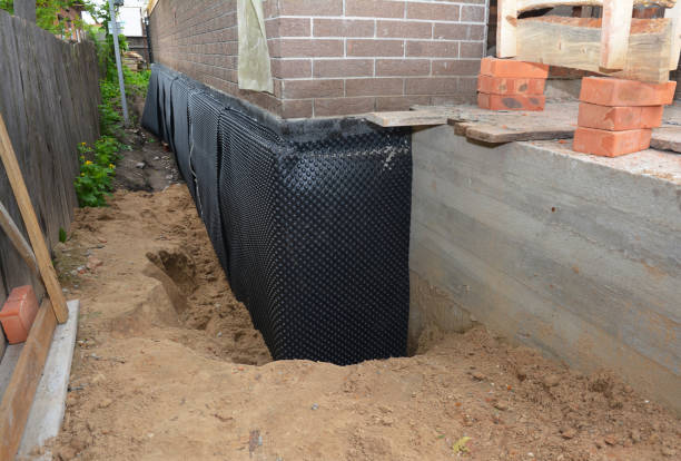 SJ Waterproofing Pros technician performing targeted Waterproofing assessment in Pineville, NC